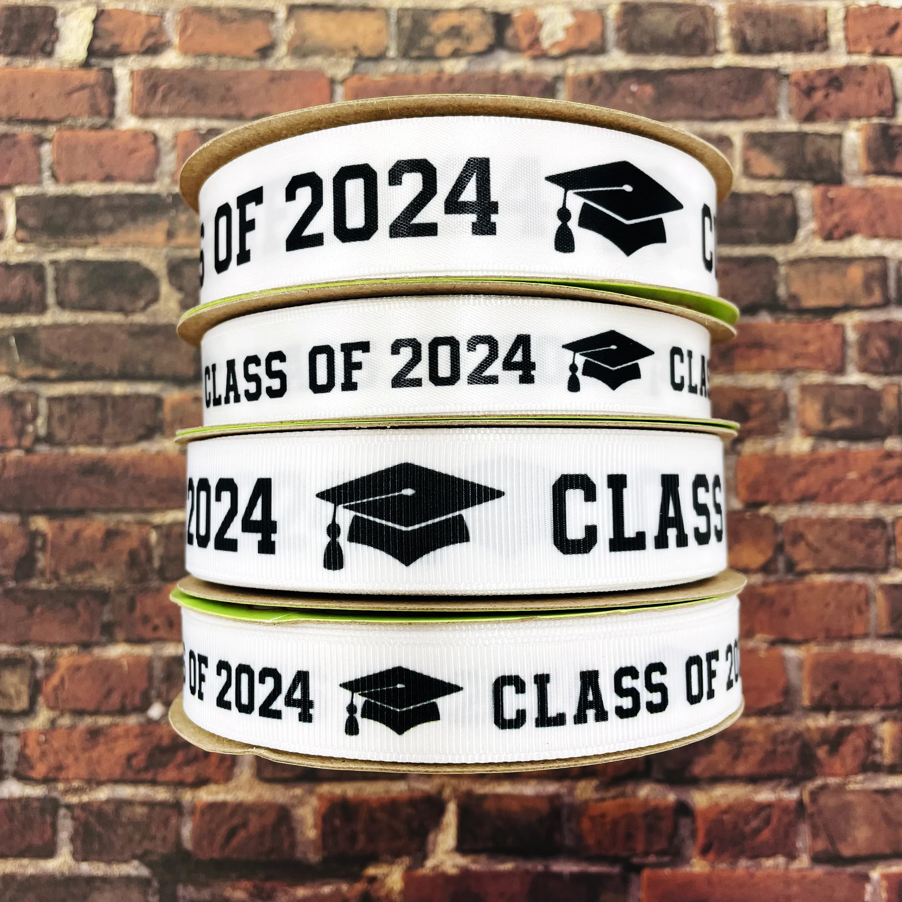 Graduation Class ribbon Class of 2024 in black with a black mortar board printed on 5/8" and 7/8" satin and grosgrain